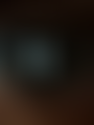 A close-up of a glowing smartphone reflected in a human pupil.