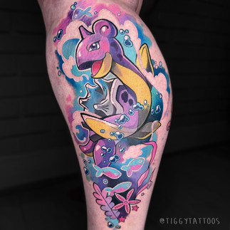 pokemon tattoo art of lapras surrounded by waves fish and water by tiggy tattoos