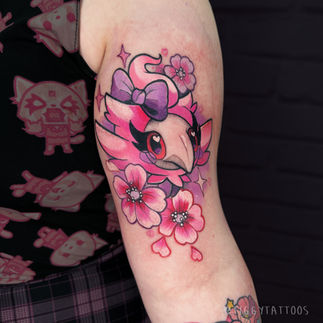 spritzee tattoo in pink with pink sakura cherry blossom flowers by pokemon tattoo artist tiggy tattoos of mt moon tattoo gloucester uk