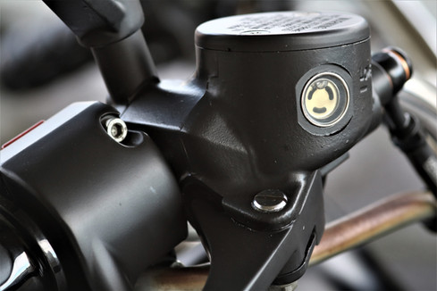 detail photo of motorcycle brake reservior