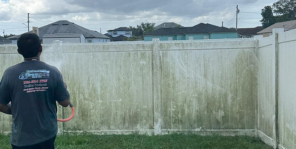 Fence cleaning in process in poinciana florida