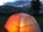 Big Agnes Copper Spur tent lit up with mountains in the background