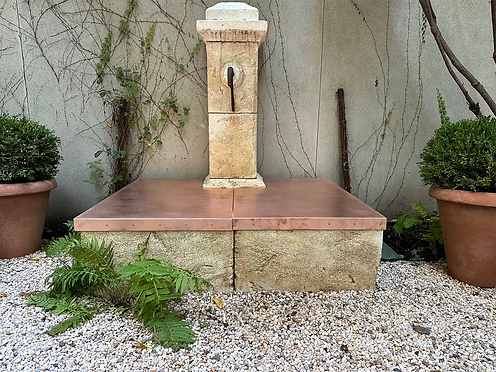 A stone and copper water feature.