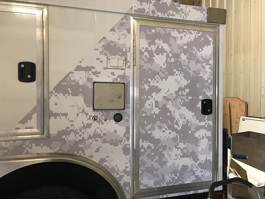 Partial wrap with gray camo for Nomad Tactical Communications Trailer | Wrap Hive