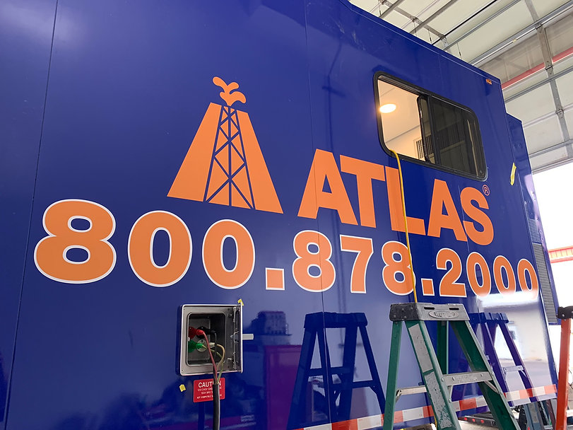 Orange decals on a blue trailer