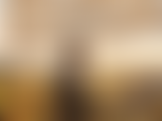 Man in a leather jacket smiles at a farm gathering under a banner reading "2025" with a quote. Autumn produce and sunset landscape.