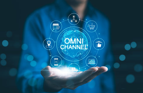 Omni Channel Marketing Concept. Businessman holding digital representation of omni-channel