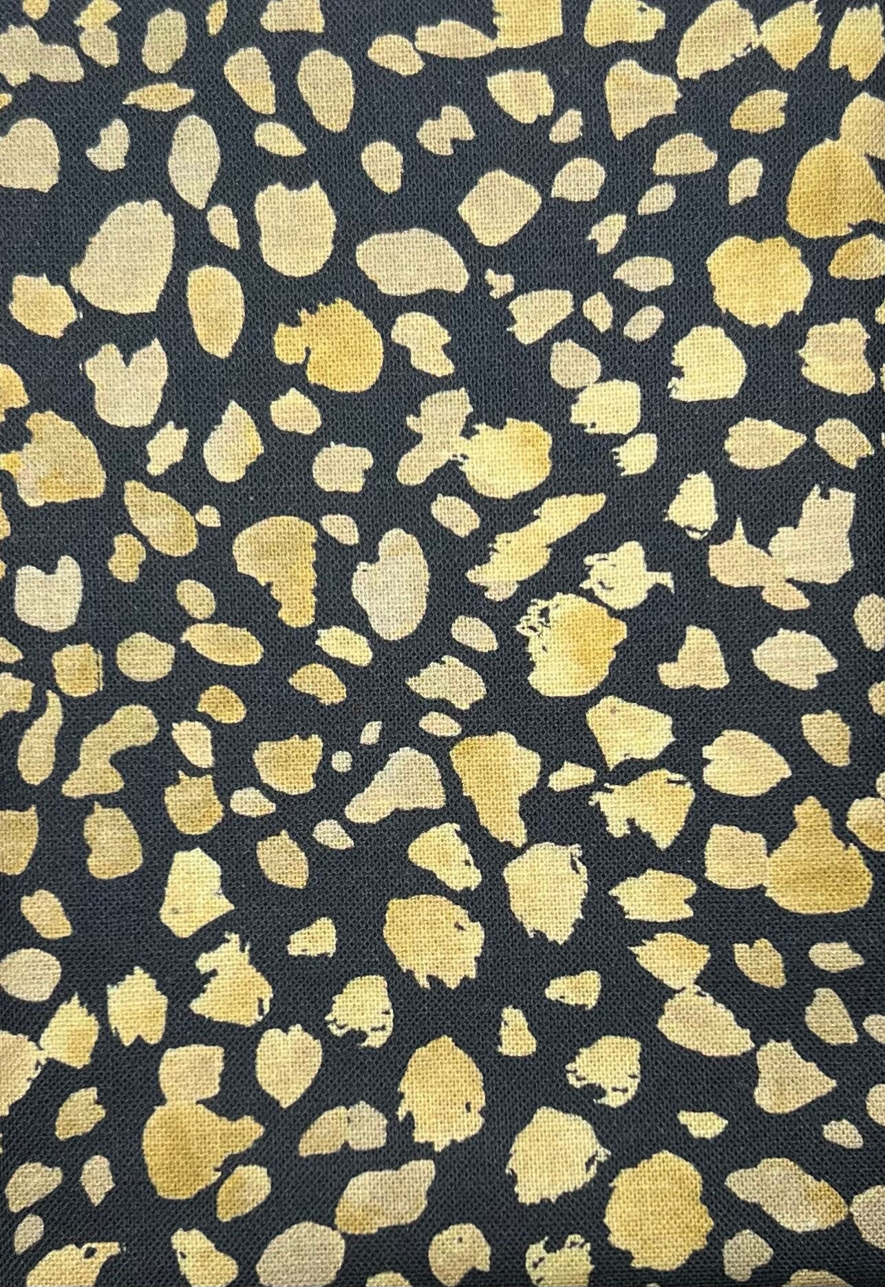 Gold animal print on dark grey cotton