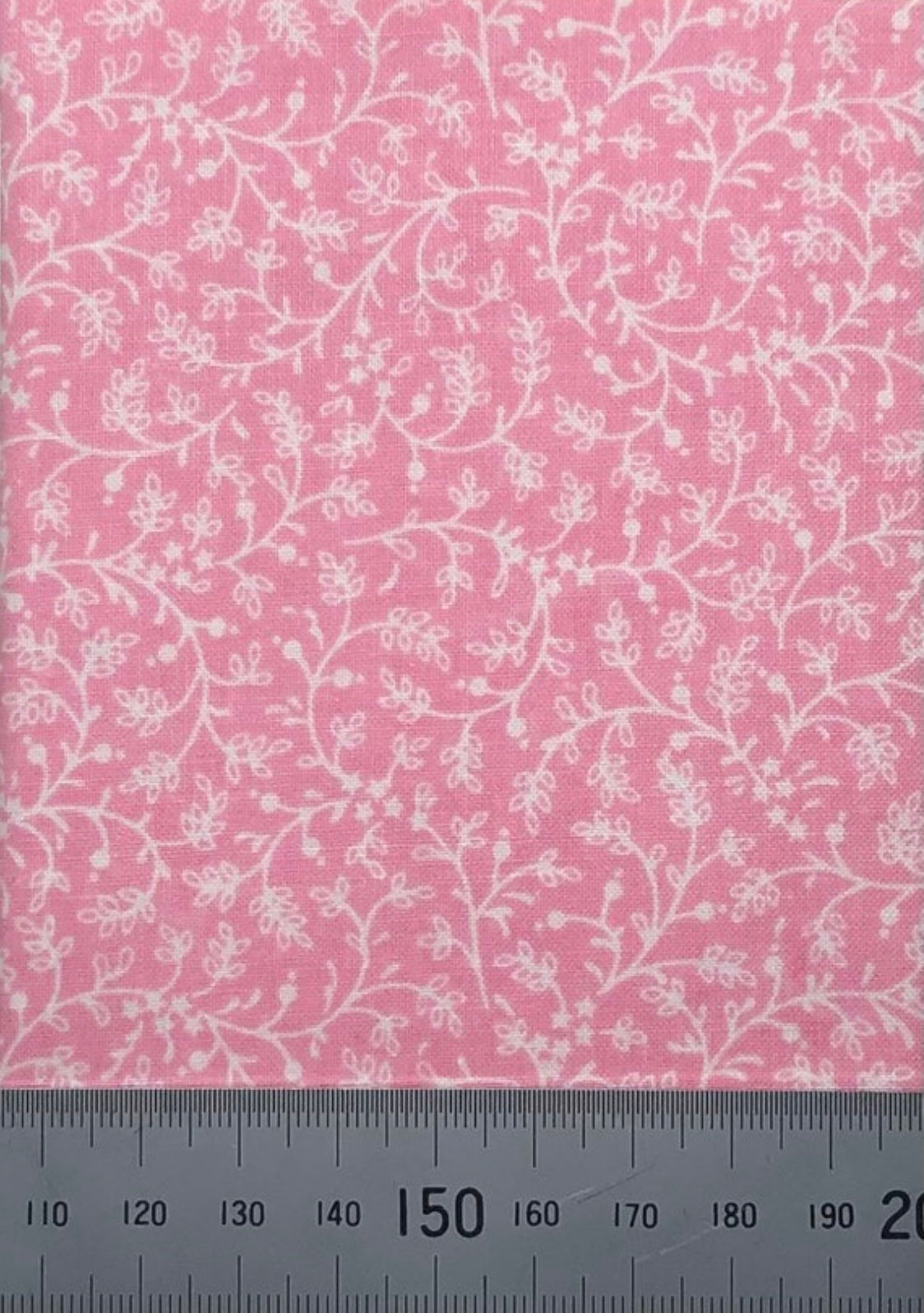 Pink cotton with white floral vines