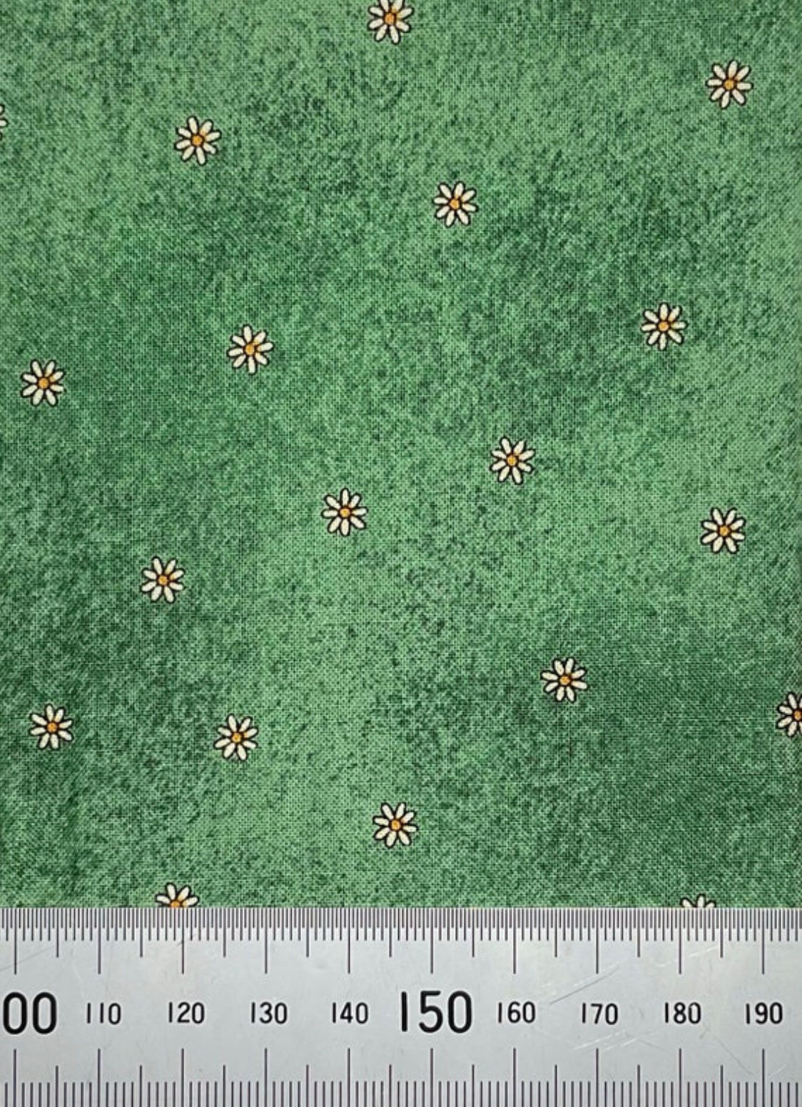 Small daisy print on green