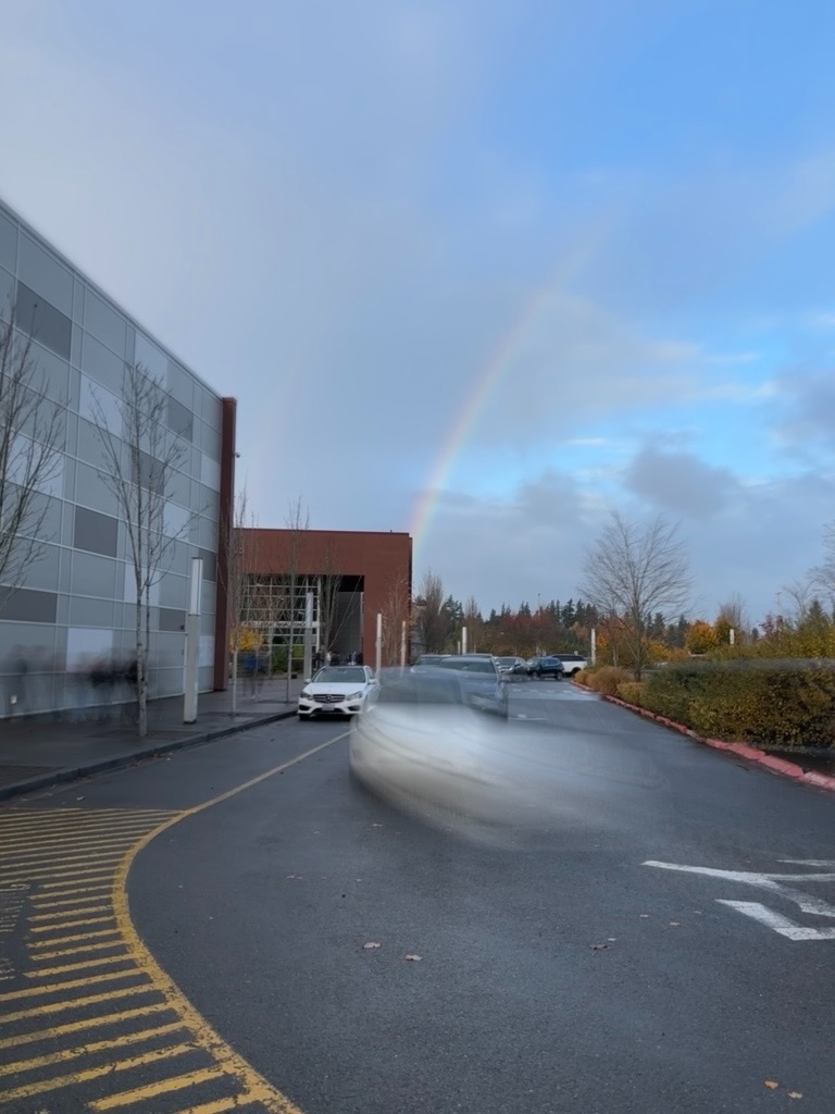 A Bellevue High drop-off lane, with an rainbow. Image by Aimee Ni.
