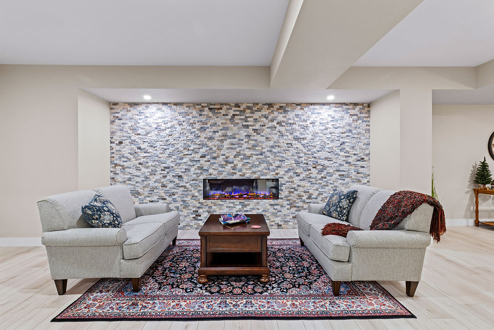 beautiful in wall fireplace with stone facia and cozy sitting area