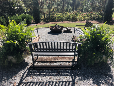 Lawn care and landscaping services creating clean outdoor seating area in Greenville South Carolina
