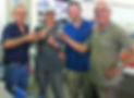 OliveOlive founder Rob Marsden and the OliveOlive team at the mill in Cyprus raising a glass to toast the new season extra virgin olive oil