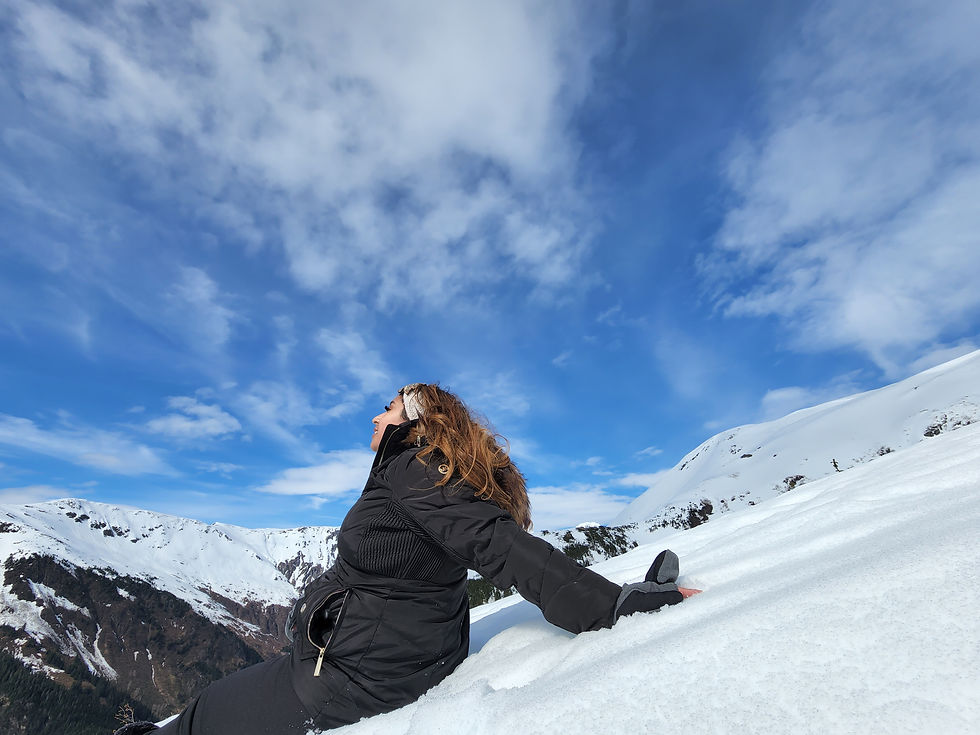 Eye-level view of a person meditating on a serene hilltop