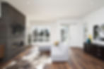 modern home addition with white furniture and newly installed hardwood floors