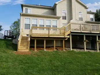 finished wood deck on the back of the home