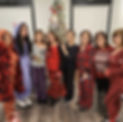 8 members of the Sittin Pretty Nail Spa team in their christmas pajamas.