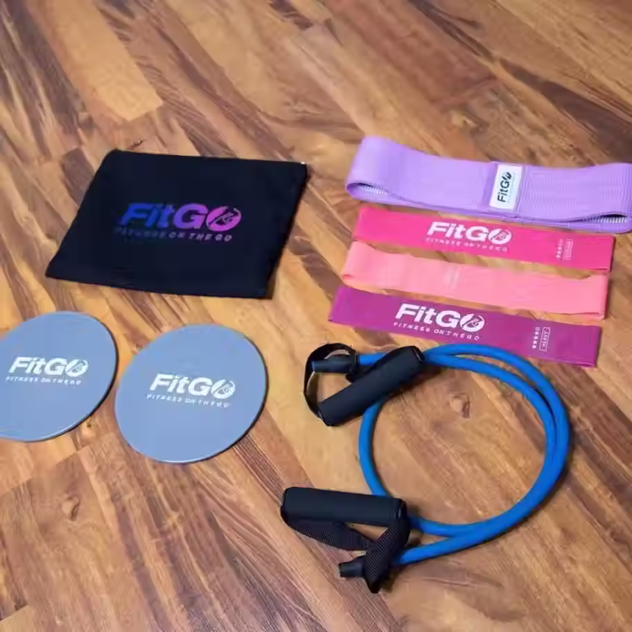 FitGo bag contents, including resistance bands, resistance cord with handles, fabric booty band, 2 dual-sided sliding discs