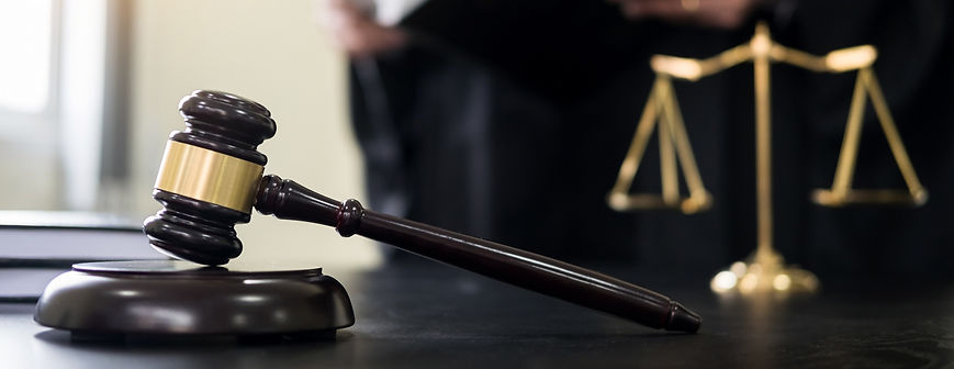 gavel and legal scales in the background
