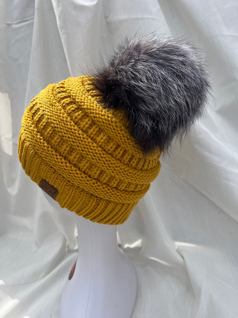 Mustard , cable knit hat with ranch fox pompom