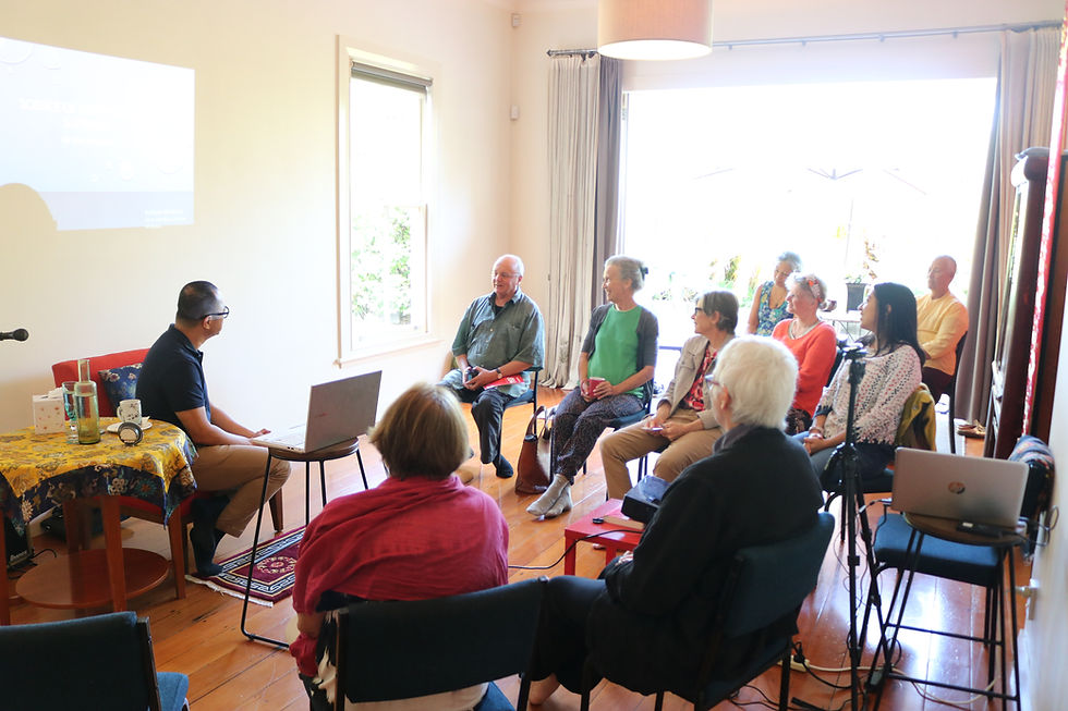 Speaker presenting to a group of listeners.