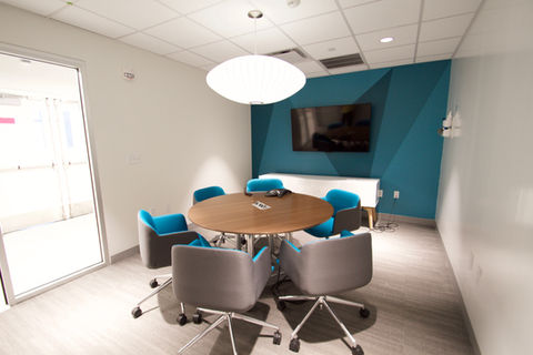 white office with teal accent wall - October Two, LLC, Location Scout & Manager