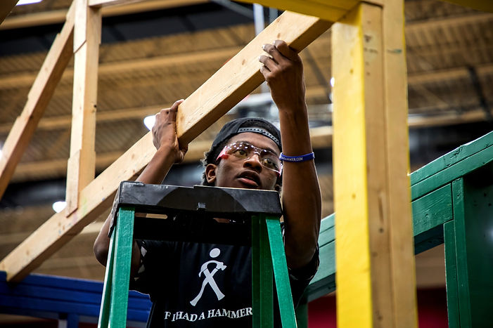 Young man building Hammer House