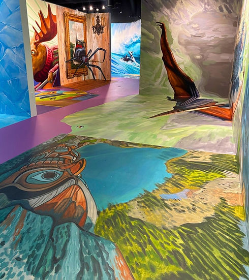 Immersive 3D floor and wall art at SnapShot inside PowerPlay Calgary, featuring a painted lake illusion, giant spider mural, and interactive photo backdrop.