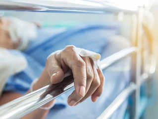 Malnourished hospital patient resting in bed during admission where nutritional decline may become relevant in medical negligence litigation