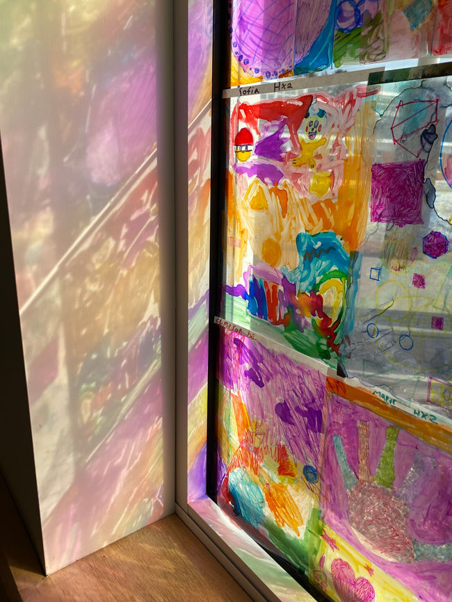 Color and light window installation with K-2nd grade students' work!