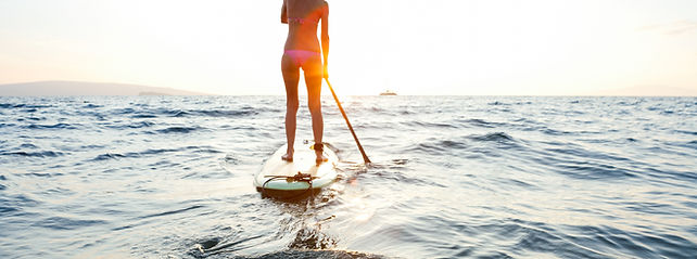 Girl on SUP at sunset