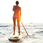Girl on SUP at sunset