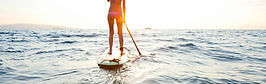 Girl on SUP at sunset
