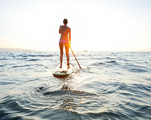 Girl on SUP at sunset