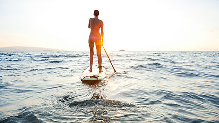 Girl on SUP at sunset