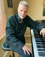 Tom Schuman-Promo Photo-Black Shirt-High Resolution-Photo Credit Yvonne Schuman.png