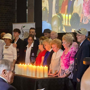 Holocaust survivors light candles commemorating the 80th Anniversary of the Liberation of Auschwitz