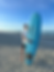 Older, more recent photo of Kyan Carrier at the beach with a surf board