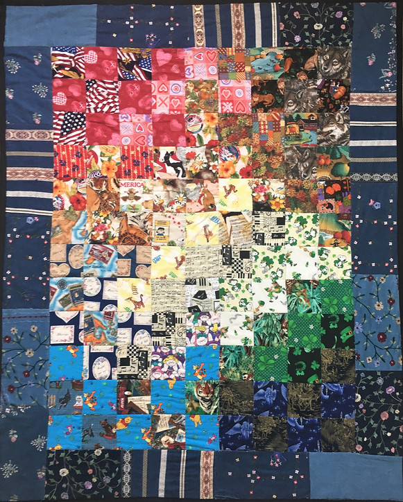 A multicolored patchwork quilt made from recycled vests
