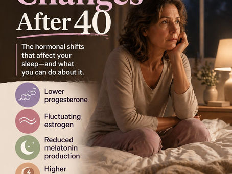 A middle-aged woman sitting awake on her bed at night, illustrating how hormonal changes like progesterone, estrogen, melatonin, and cortisol can affect sleep after 40.