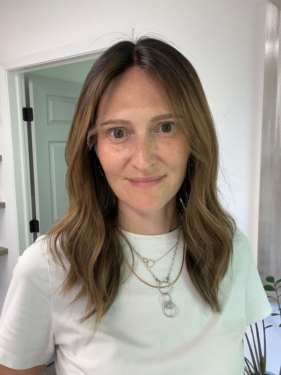 Thumbnail: Woman wearing a medium length brunette human hair wig