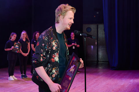man gives out award