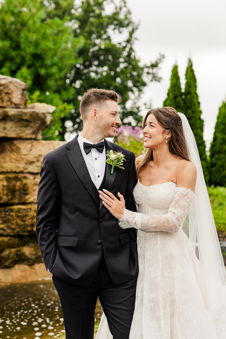 bride and groom portraits outside the drake in oak brook smiling in a traditional portrait