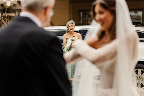 mom watching the father daughter first look