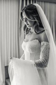 black and white of bride having a moment before leaving for the church