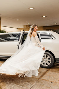 bride getting into the limo heading to the church