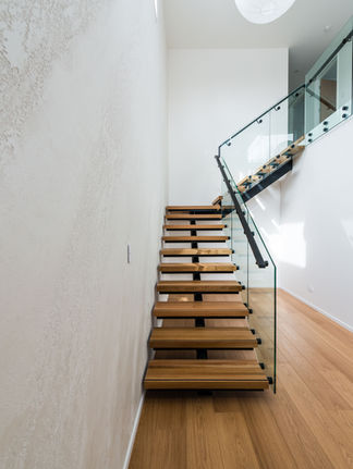 White split stone plaster finish stairwell