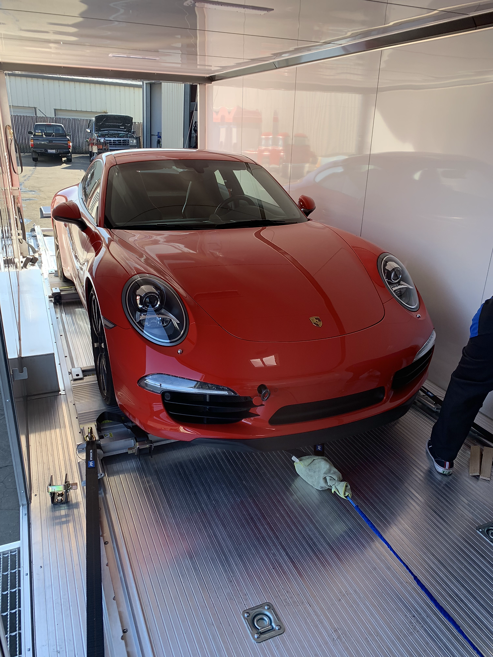 RJM loading a 2014 Ferrari 458 Italia