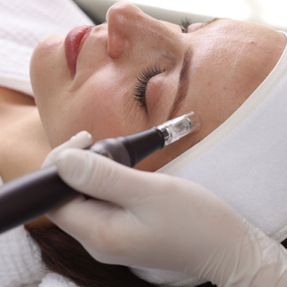 Woman relaxing during a luxury spa treatment focused on monthly wellness, skincare maintenance, and intentional self-care.